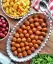 طرز تهیه کوفته سرگنجشکی یا کله گنجشکی خوشمزه با آرد نخودچی و سس مخصوص